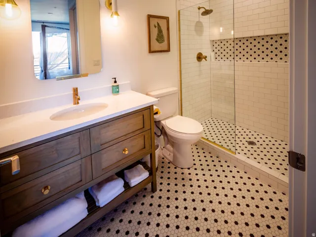 Bathroom featuring vanity and a walk in shower