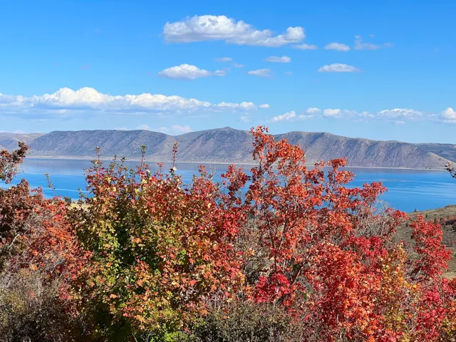 View of mountain backdrop featuring a nearby body of water