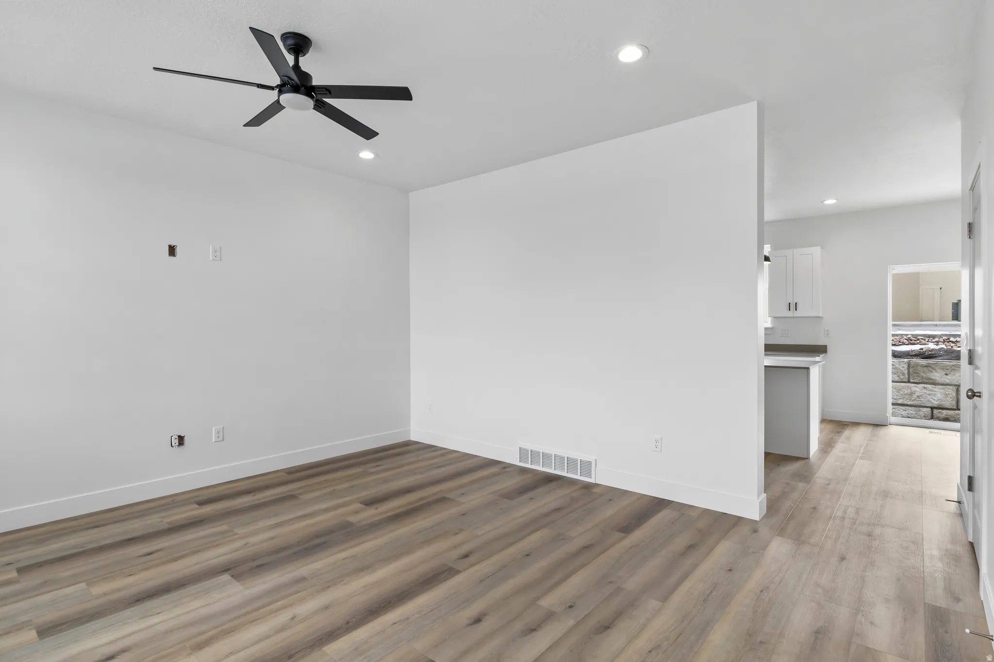 Spare room featuring ceiling fan, recessed lighting, and light wood-style flooring
