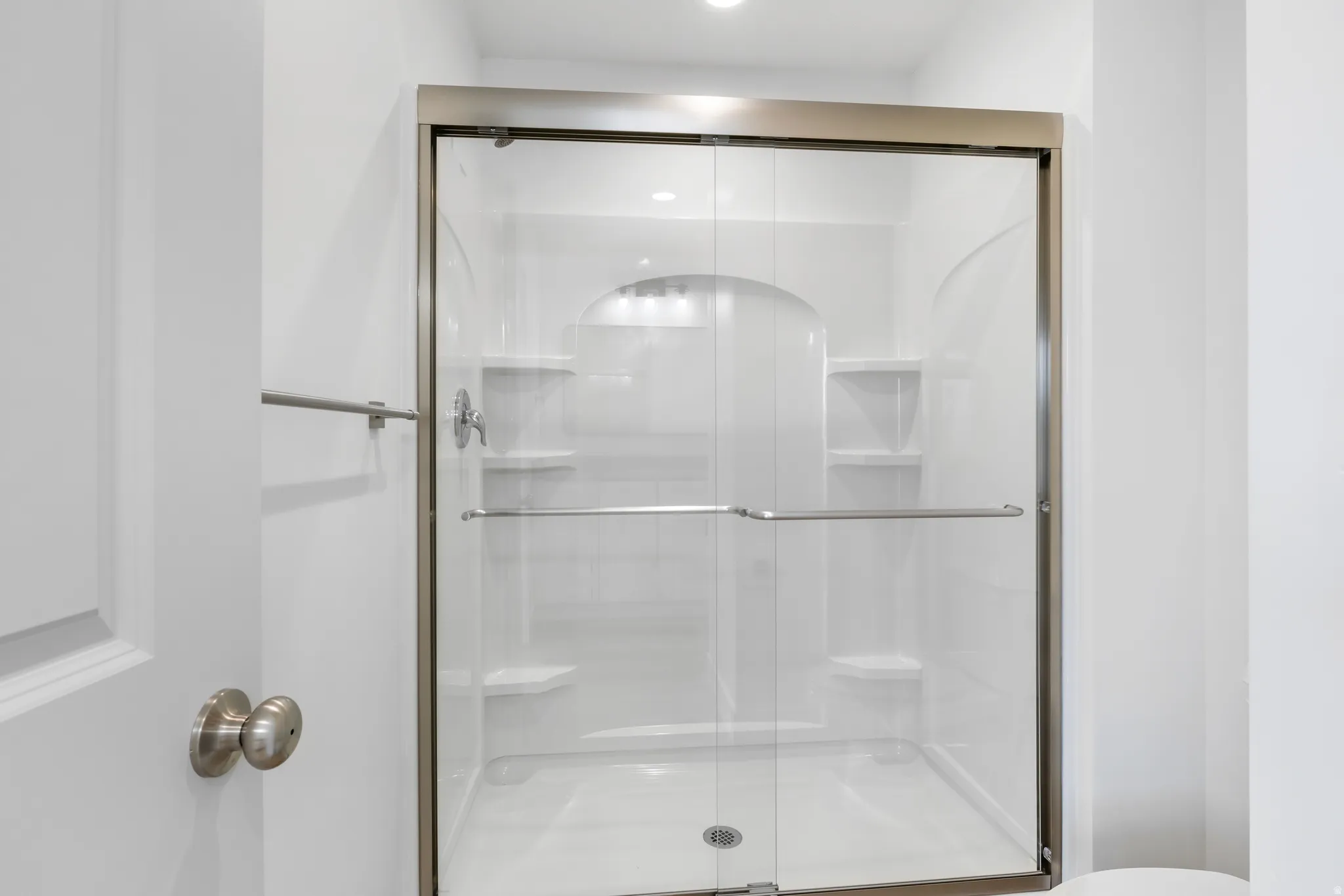 Bathroom featuring a shower stall