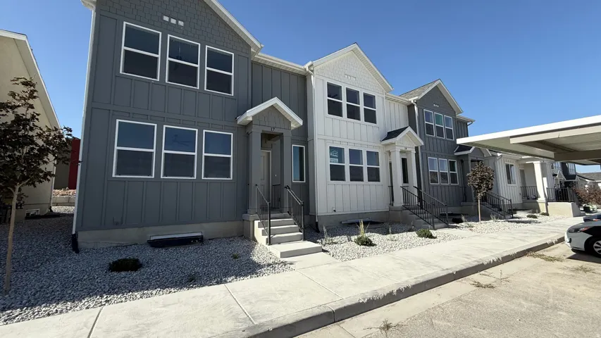 View of front of home featuring board and batten siding and entry steps