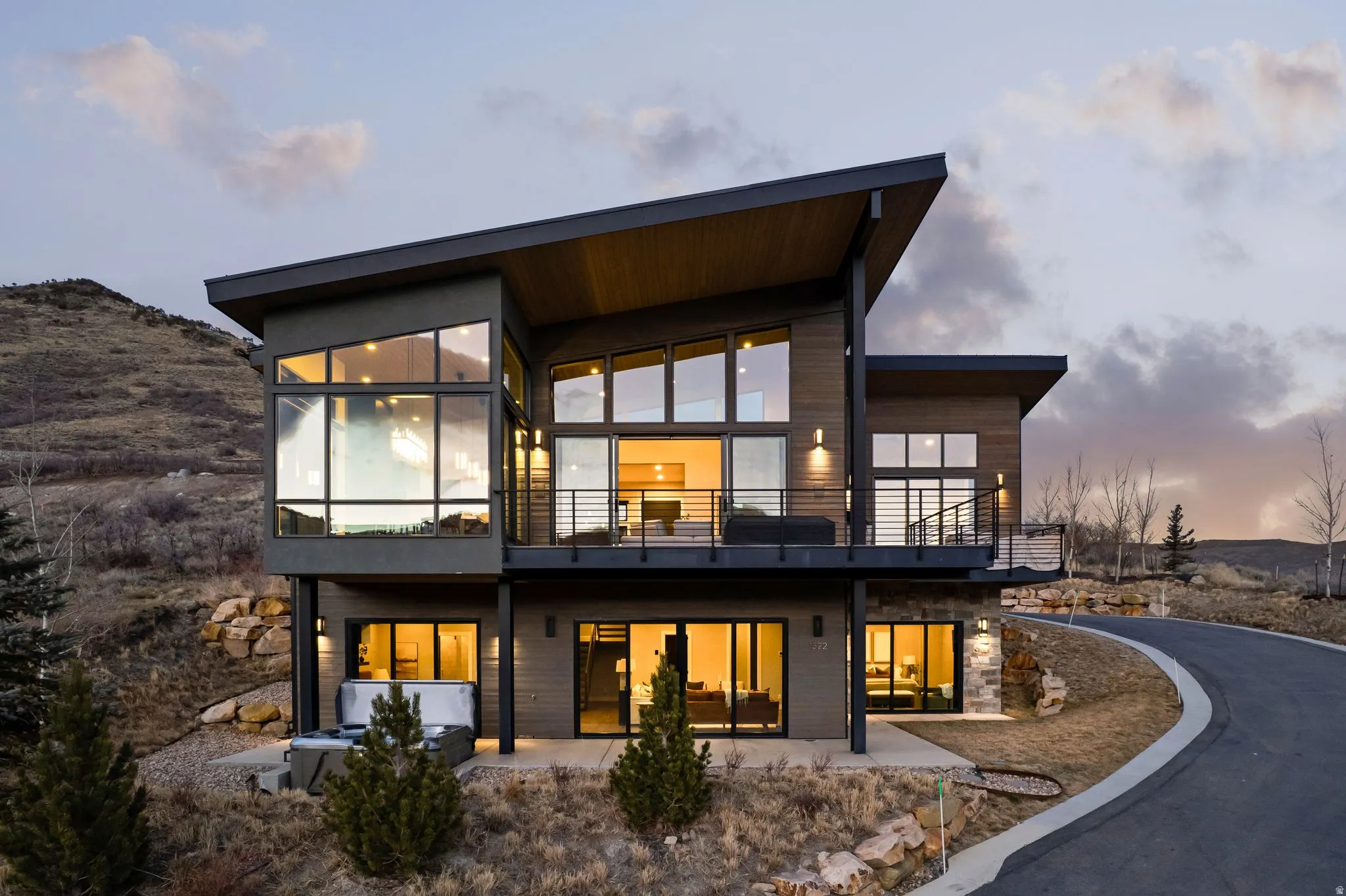 Rear view of house featuring a patio and a balcony