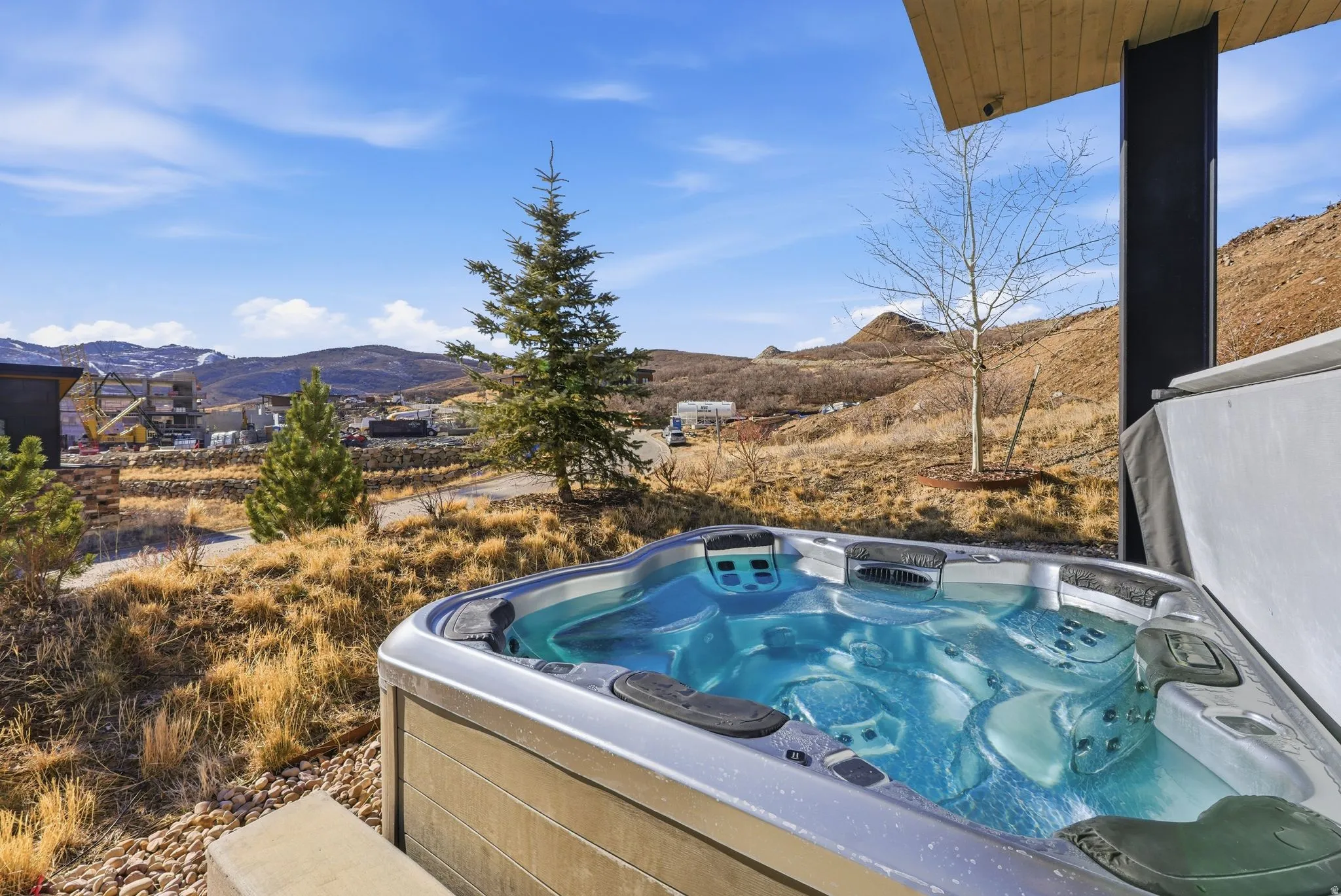 Exterior view of a mountain backdrop and a hot tub