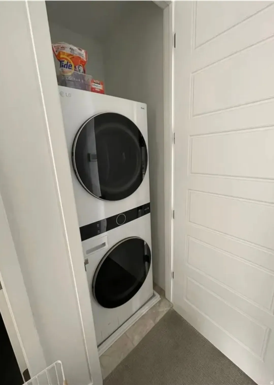 Laundry area featuring stacked washer / dryer