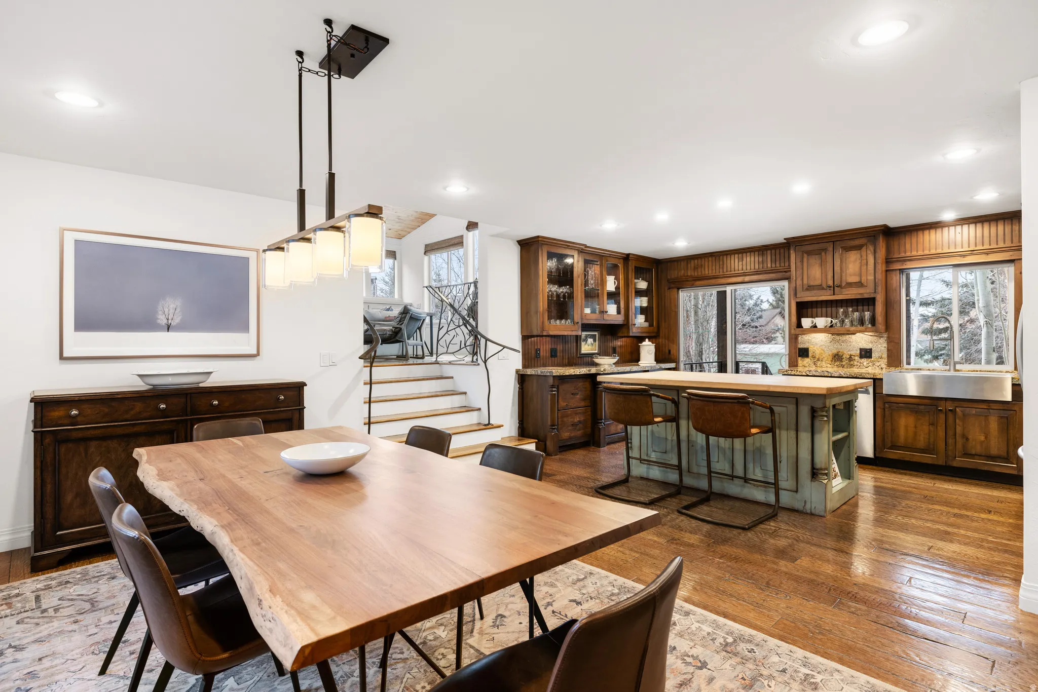 Dining room featuring dark wood-style flooring and recessed lighting