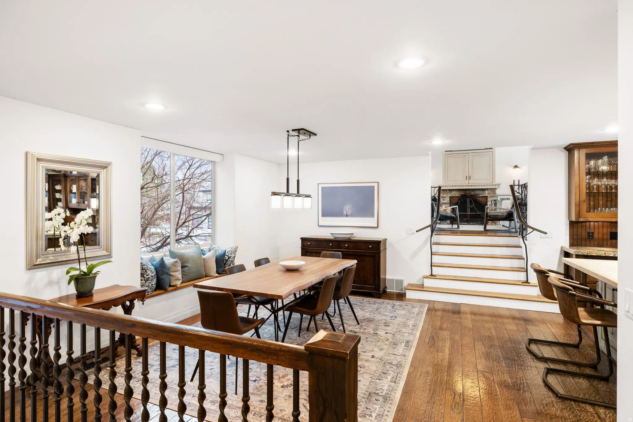 Dining area featuring dark wood-style floors and recessed lighting