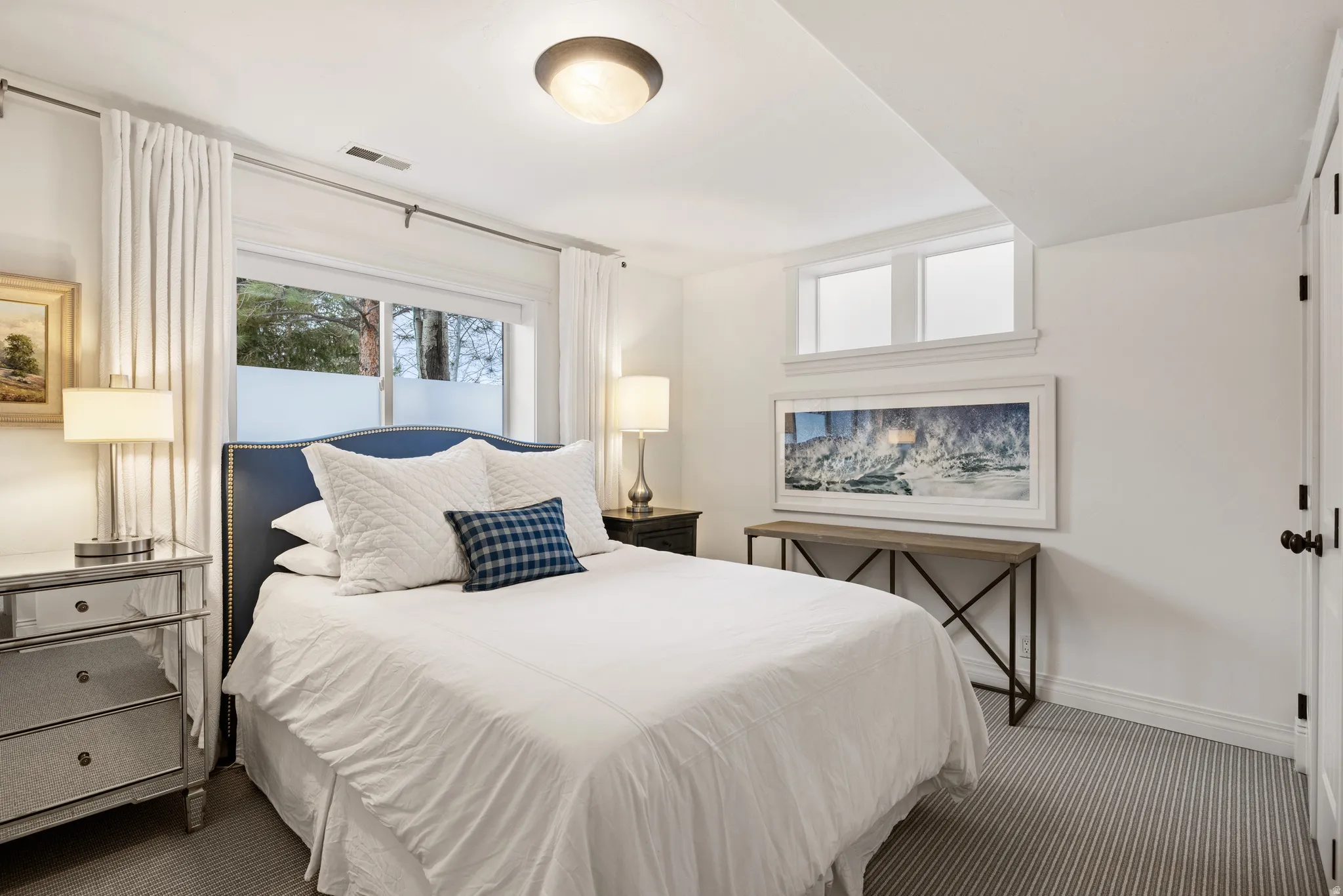 Bedroom featuring carpet flooring and baseboards