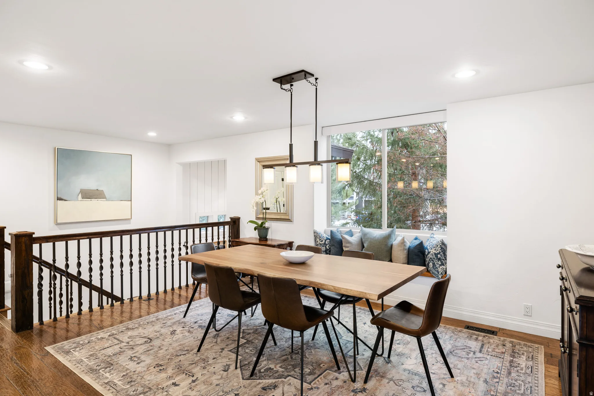 Dining space featuring dark wood-style floors and recessed lighting