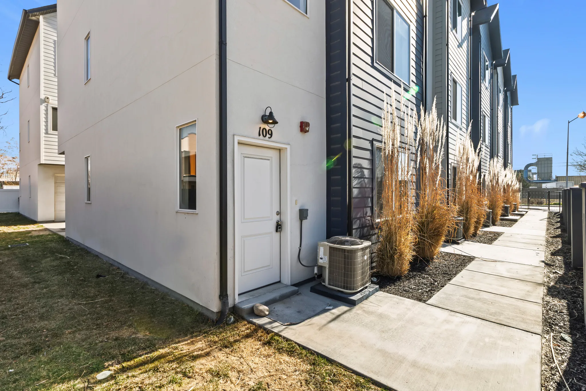 View of exterior entry featuring stucco siding