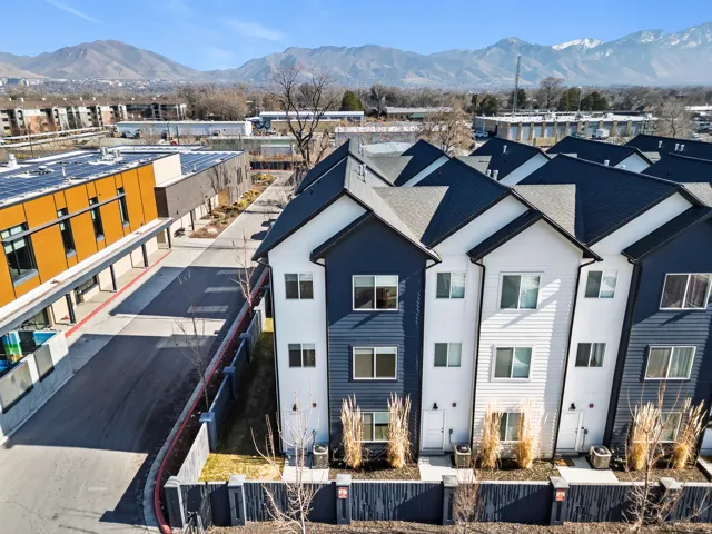 Aerial view of residential area featuring a mountain backdrop
