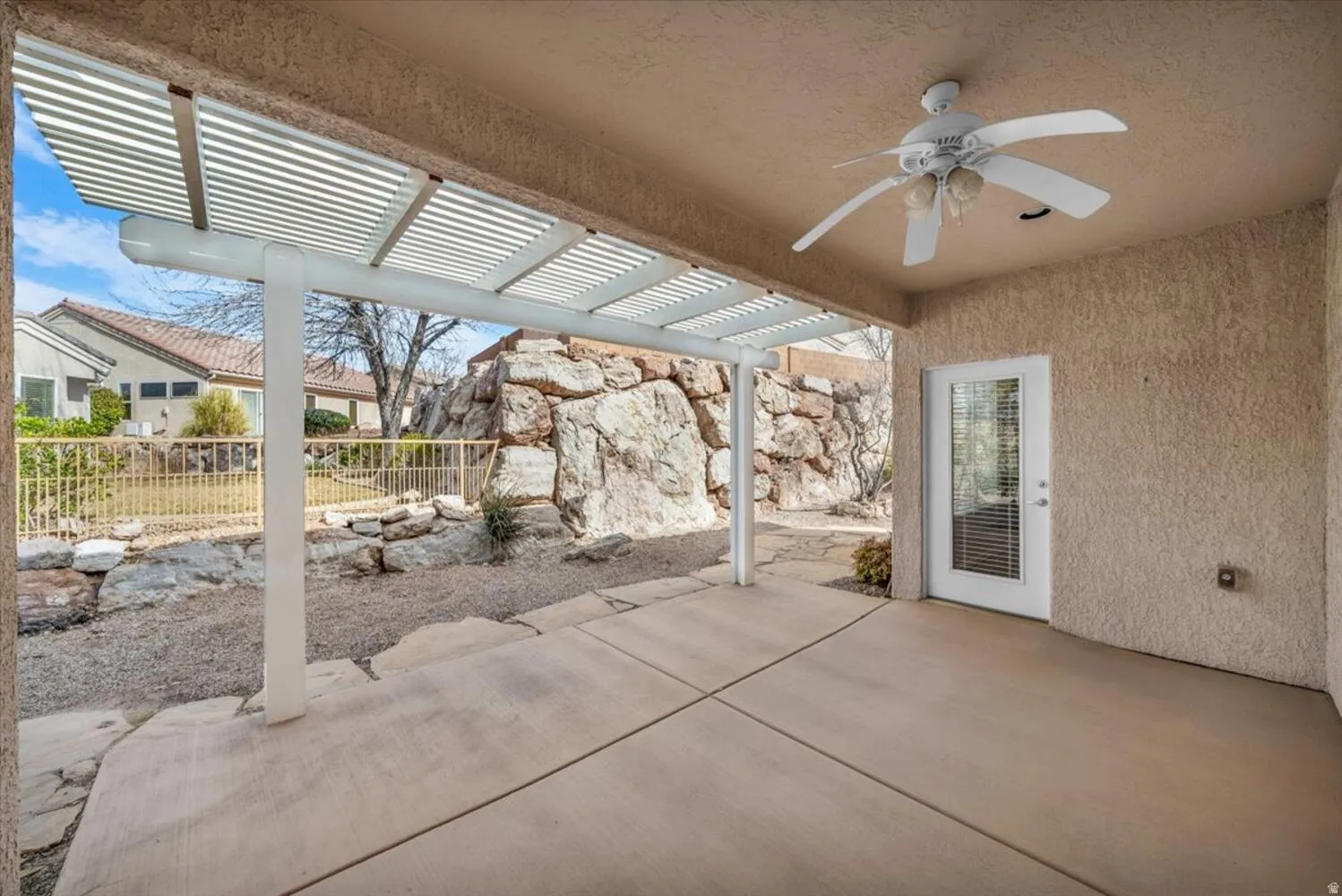 View of patio featuring a pergola and a ceiling fan