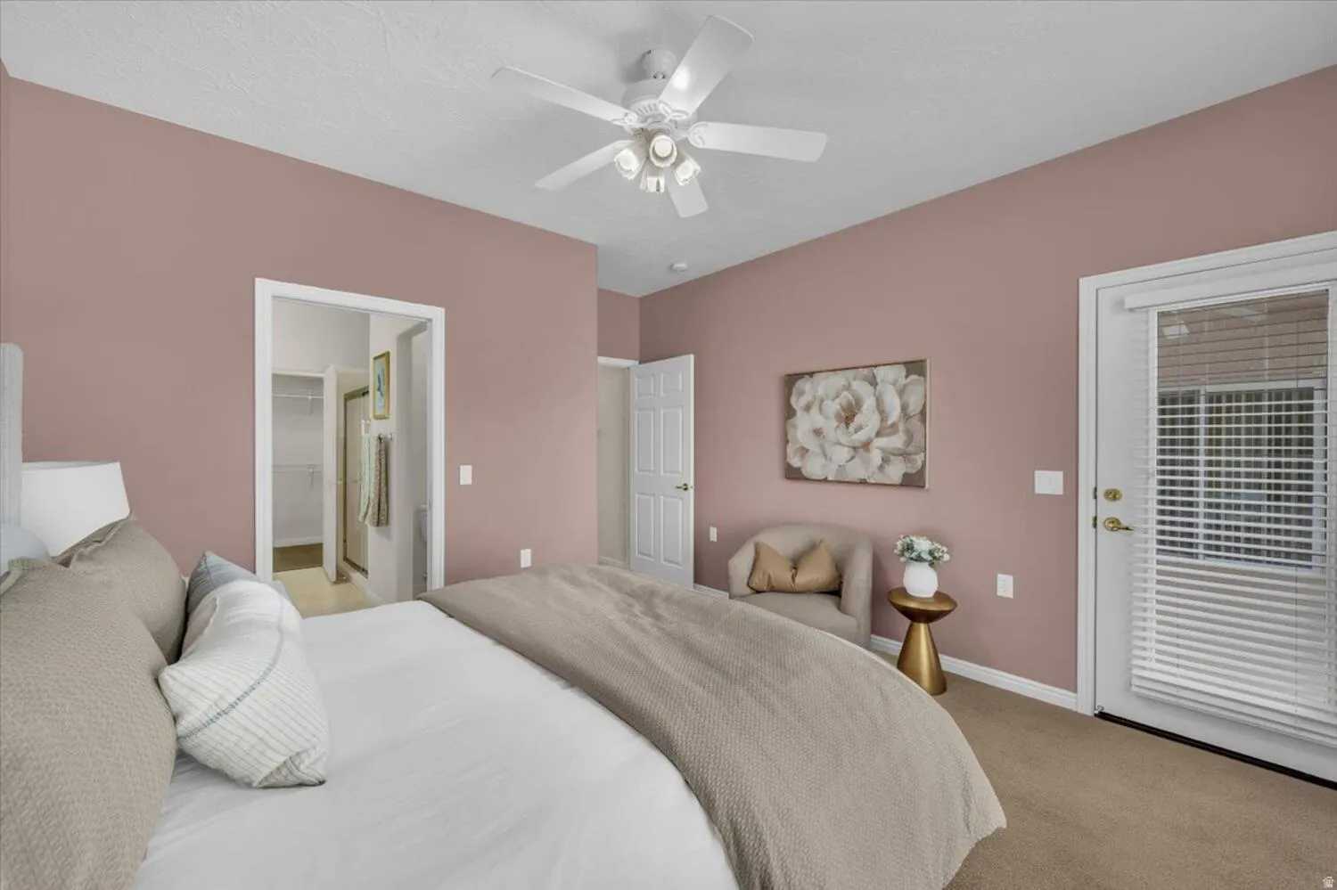Bedroom featuring carpet flooring, ceiling fan, access to outside, and a walk in closet