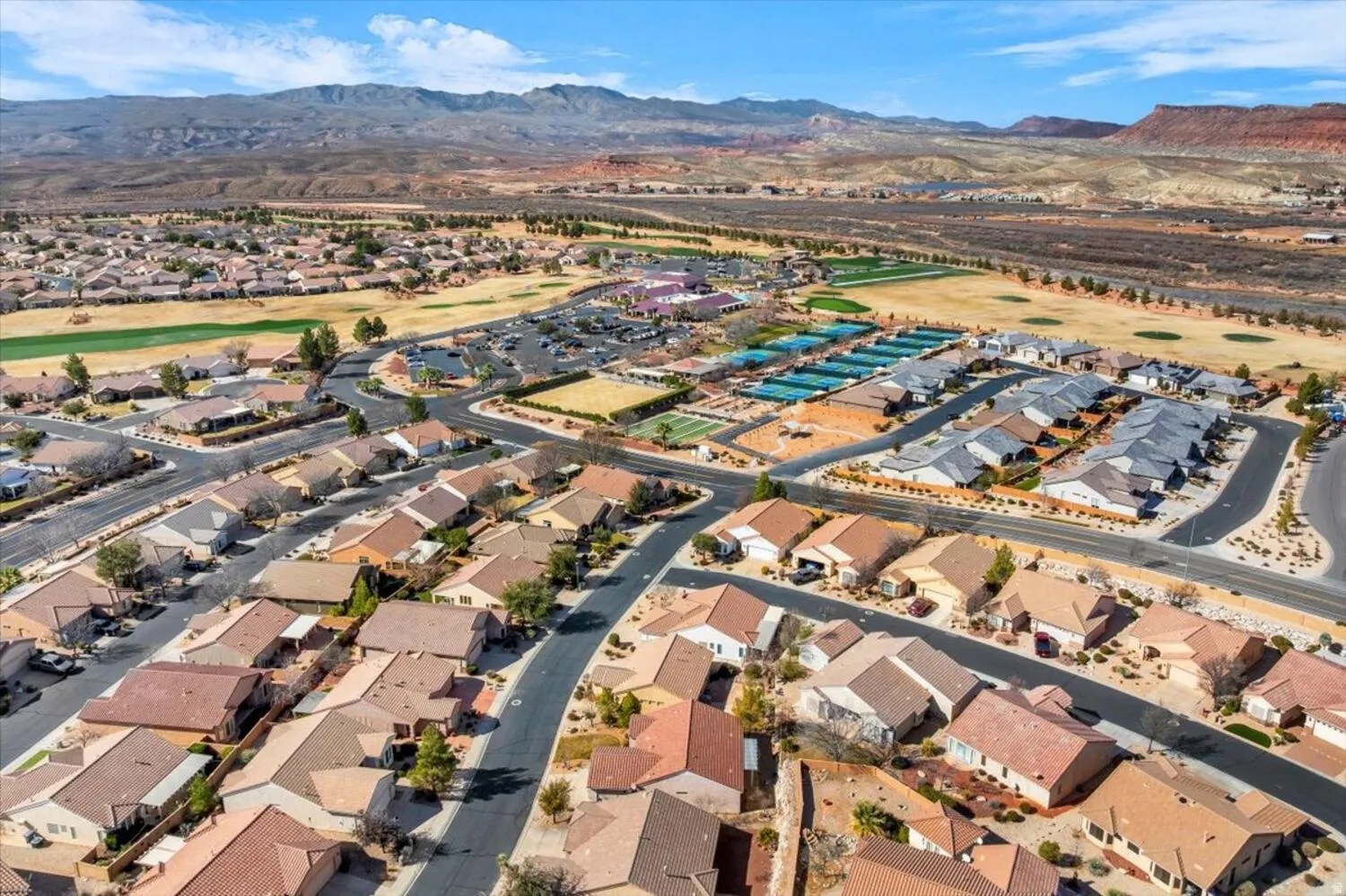 Aerial overview of property's location featuring a mountainous background