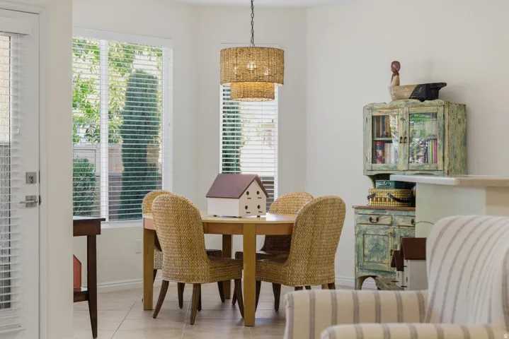 Tiled dining room with baseboards