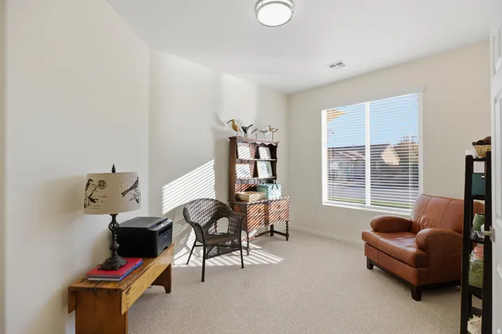 Living area with carpet and baseboards