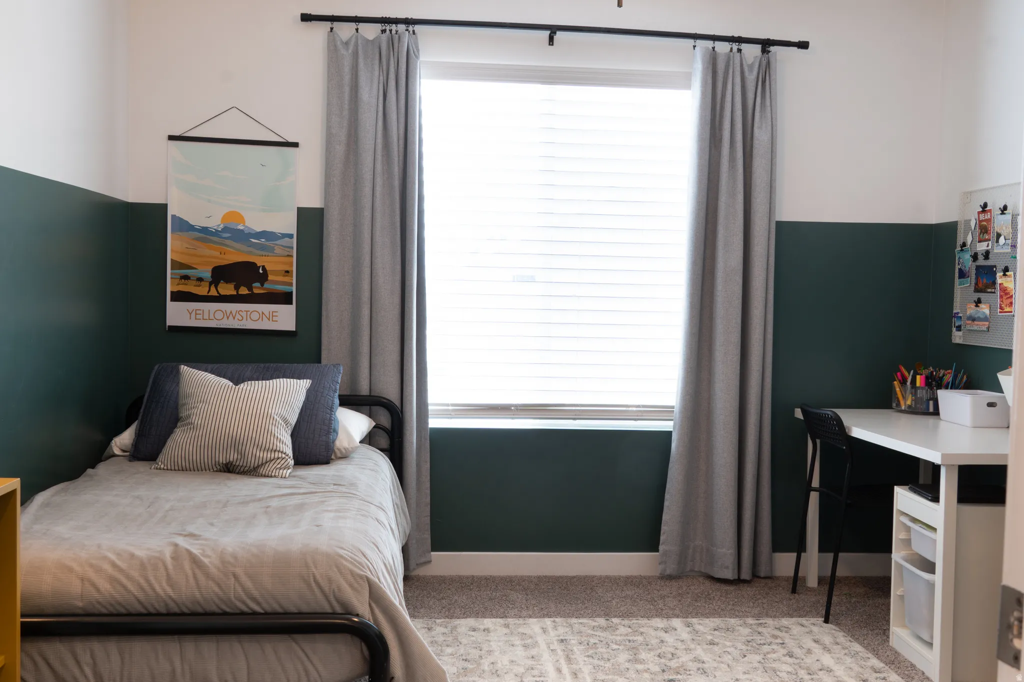 Bedroom featuring light colored carpet