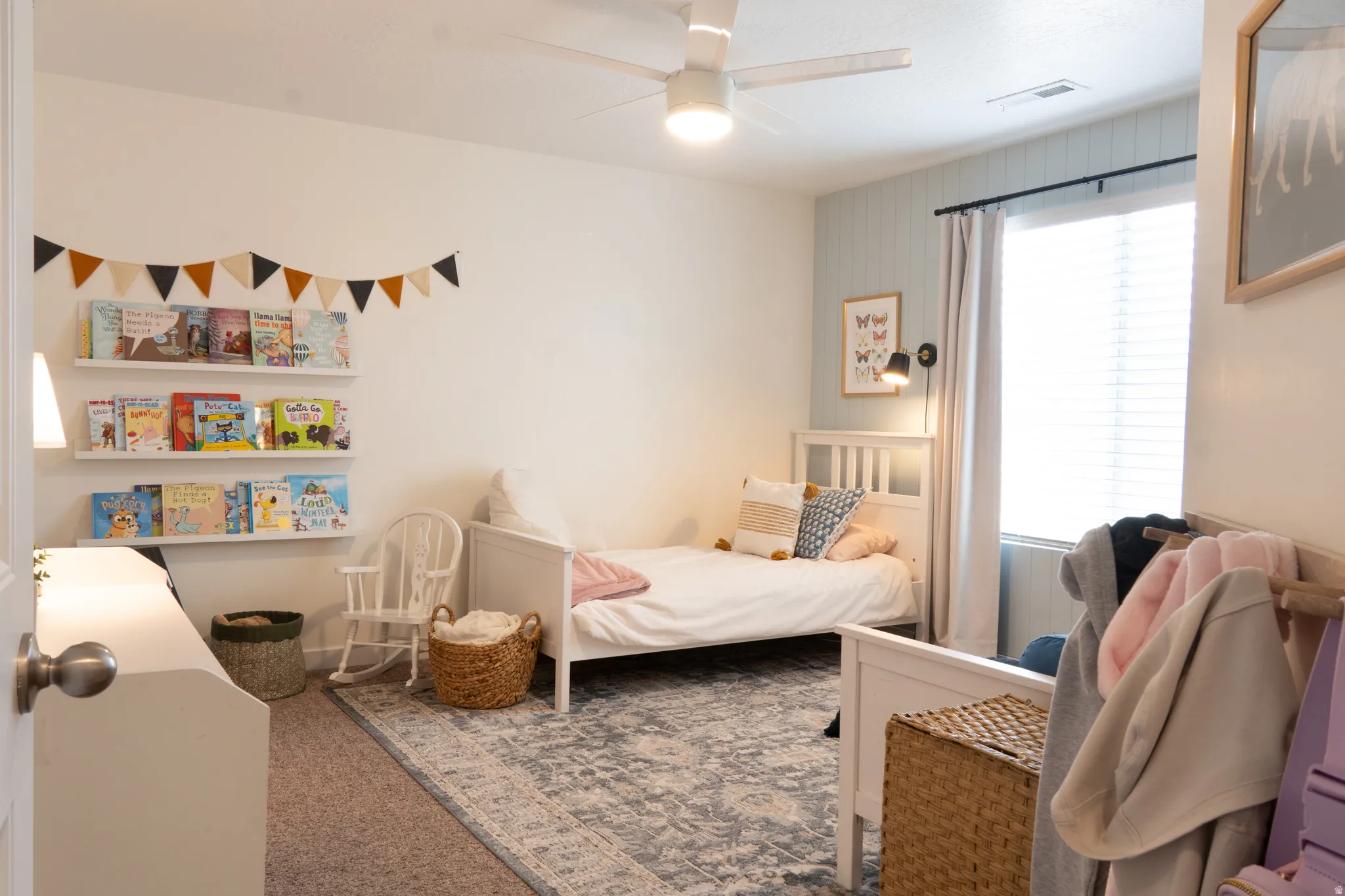 Bedroom featuring carpet flooring and a ceiling fan