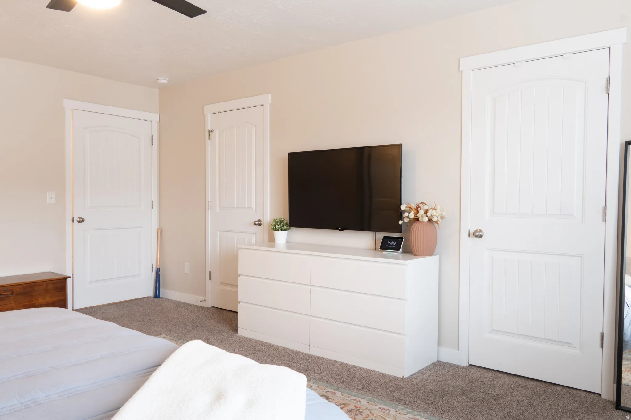 Bedroom with carpet floors and a ceiling fan