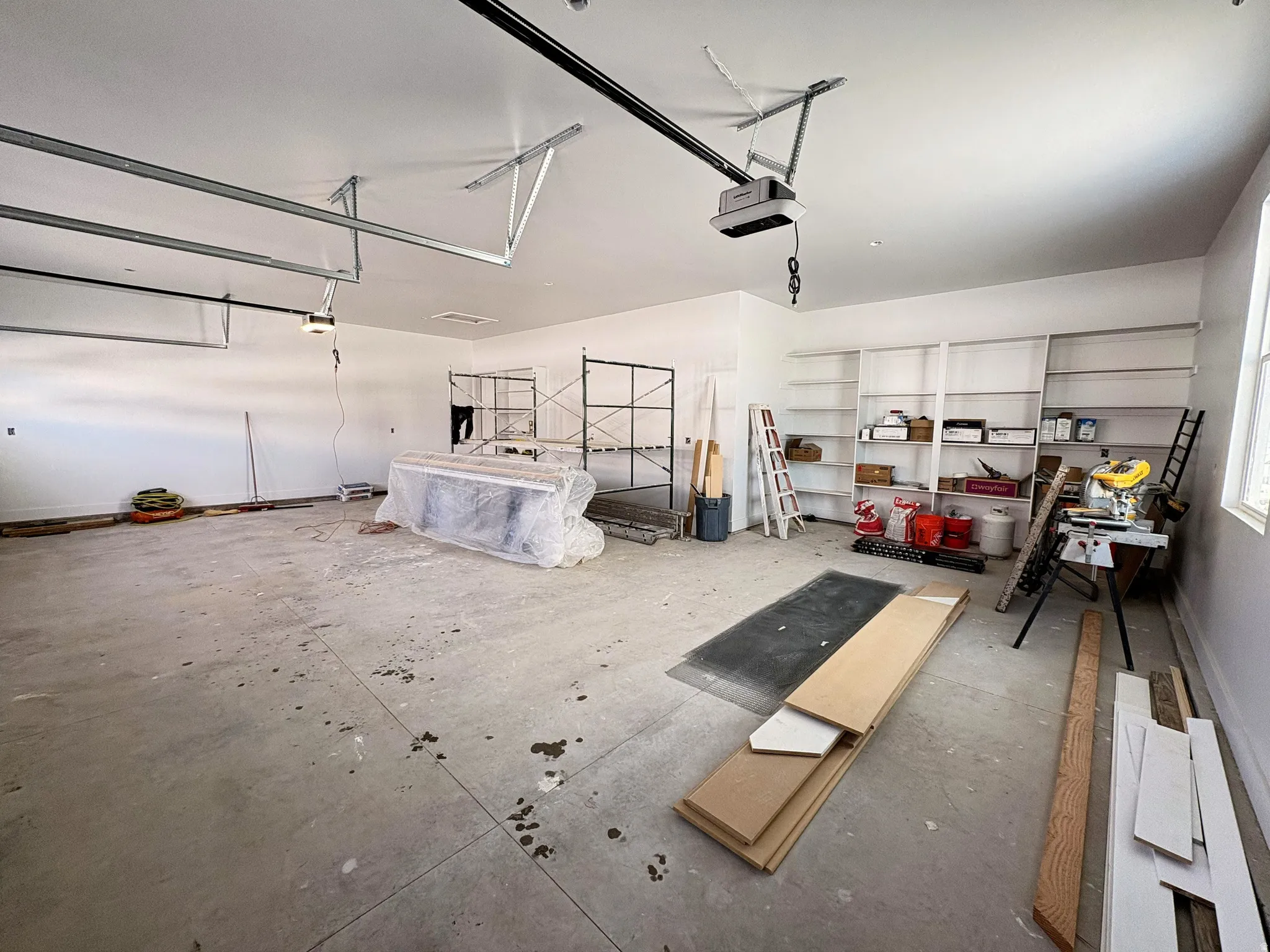 Garage featuring a garage door opener