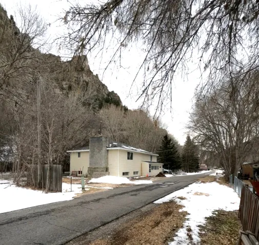 View of asphalt street with a mountain view