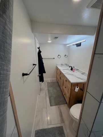Full bath with vanity and toilet