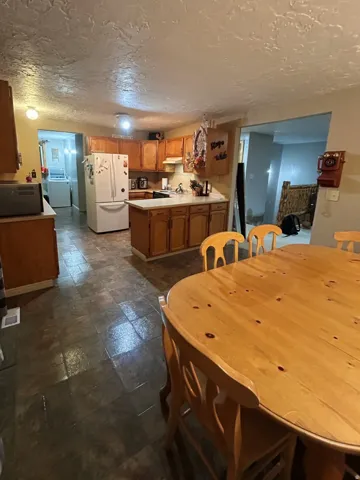 Dining room featuring a textured ceiling