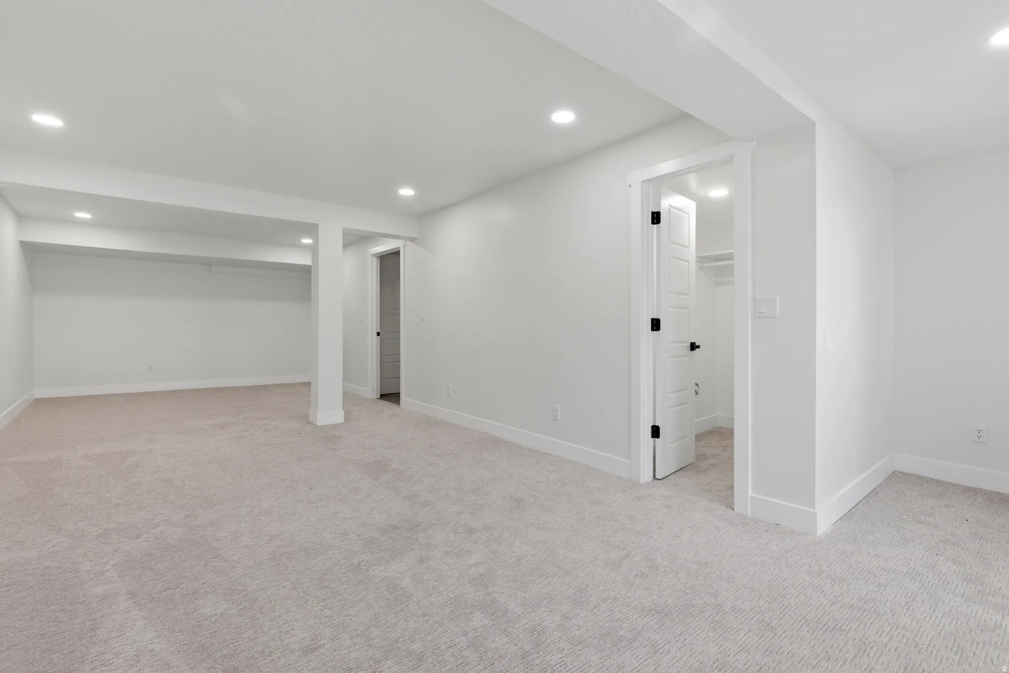 Finished basement featuring recessed lighting and light colored carpet