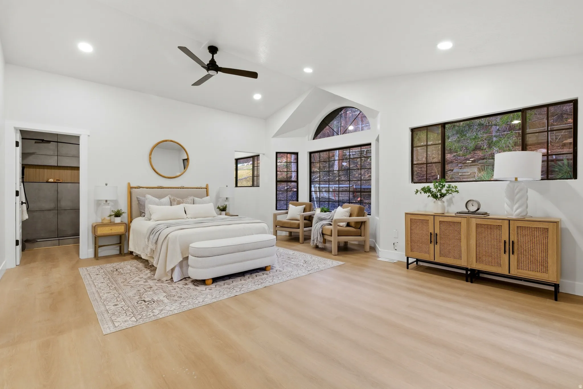 Bedroom featuring light wood-style floors, ceiling fan, vaulted ceiling, and recessed lighting