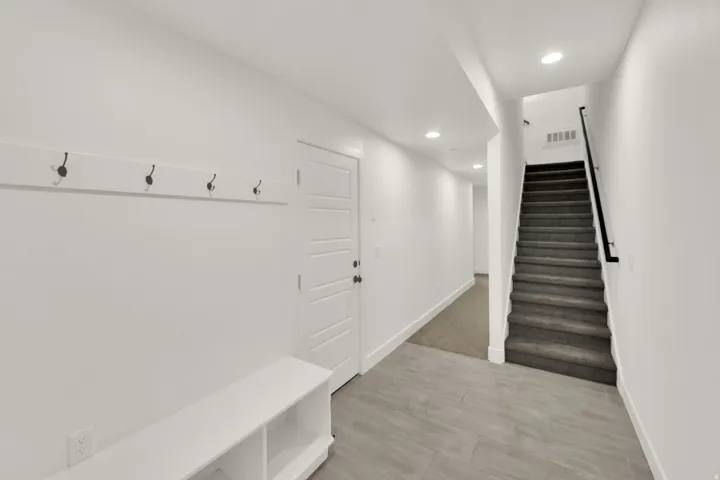 Mudroom with baseboards and recessed lighting
