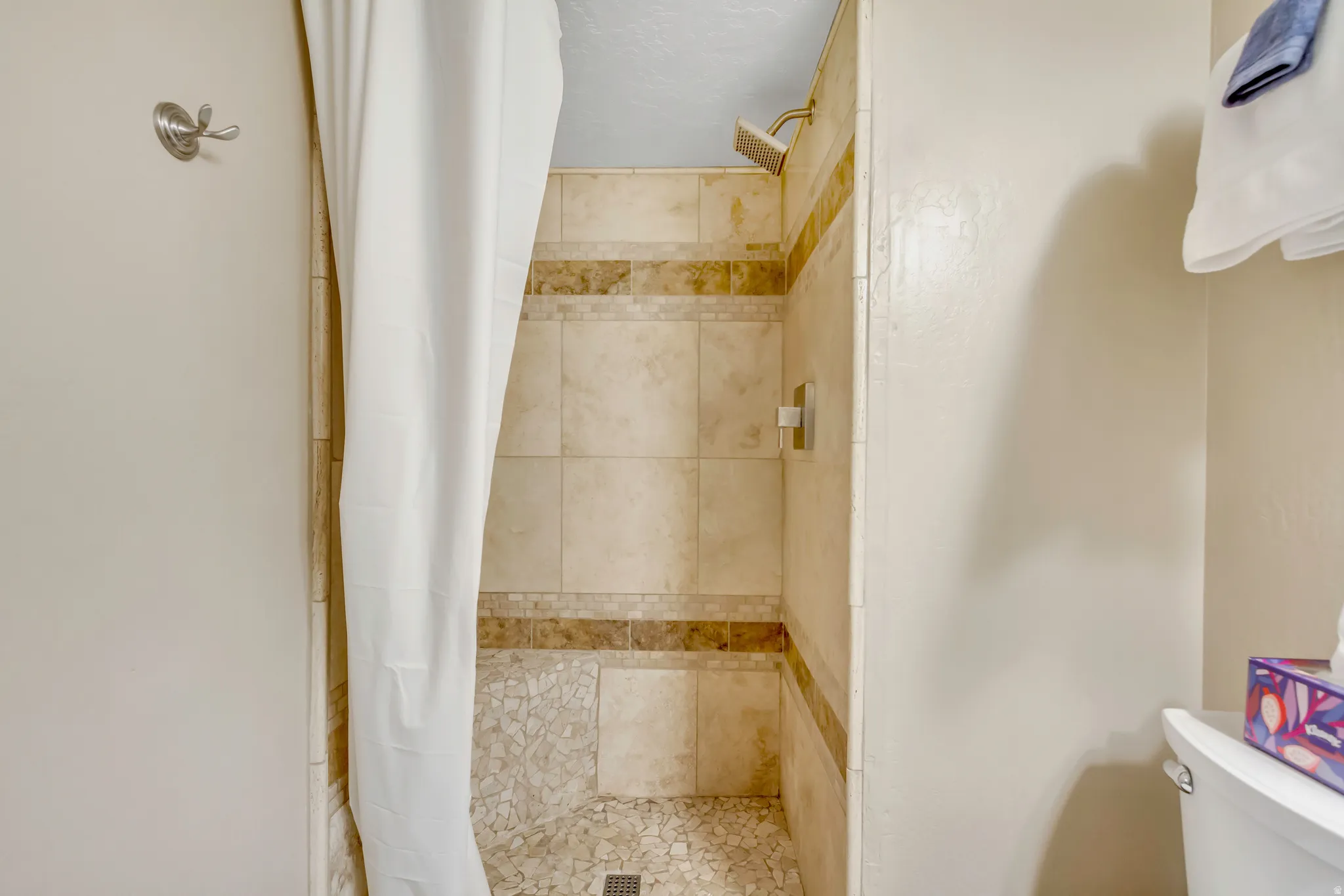 Full bathroom with a shower stall