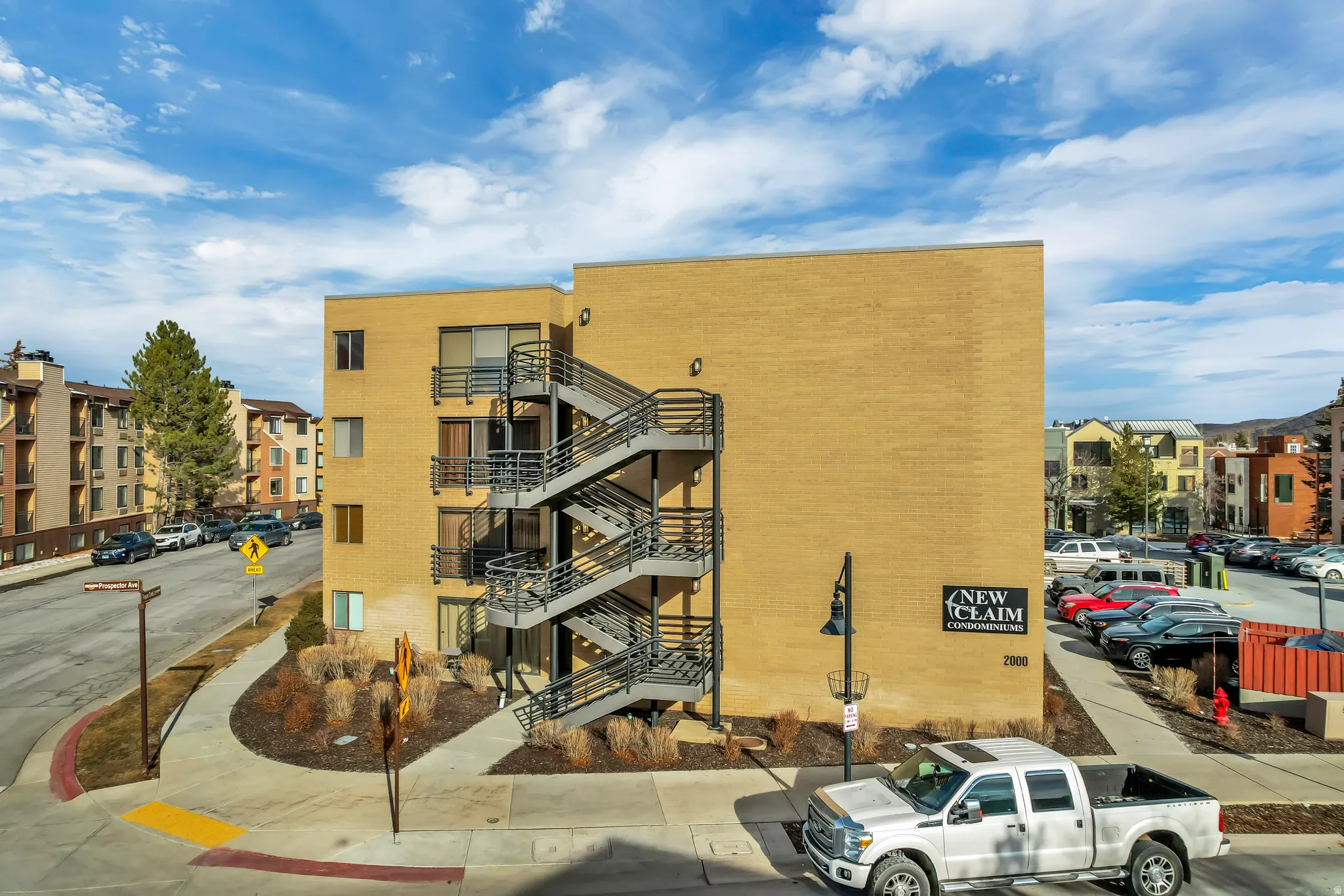 View of apartment building / complex with stairs