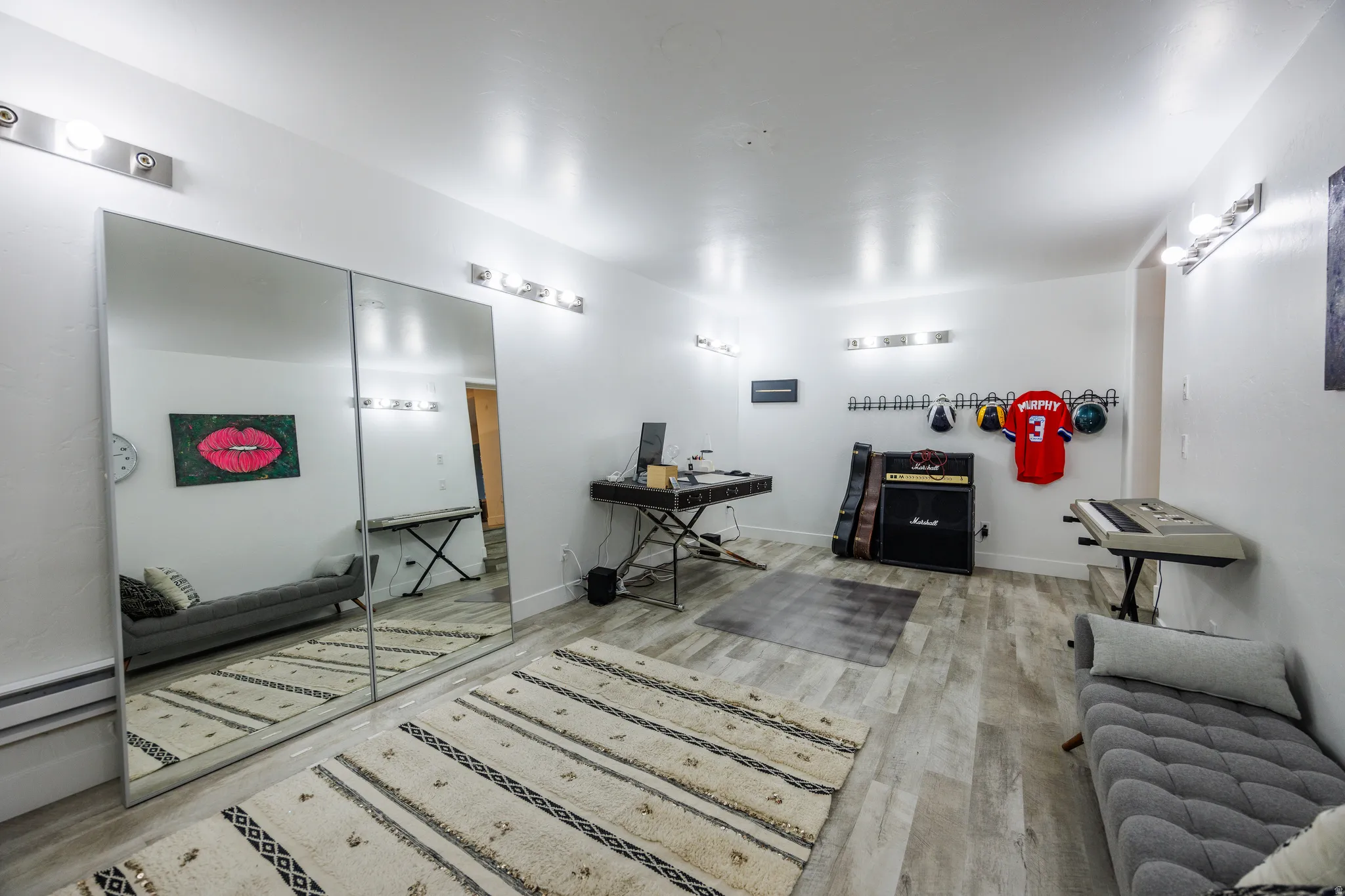 Living area featuring light wood-style flooring and a desk