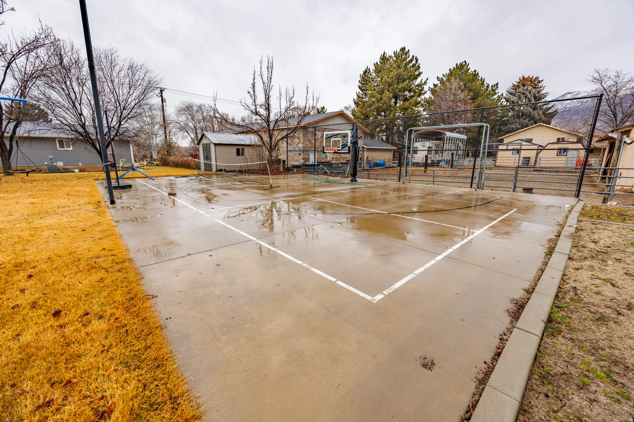 View of sport court with community basketball court and a residential view