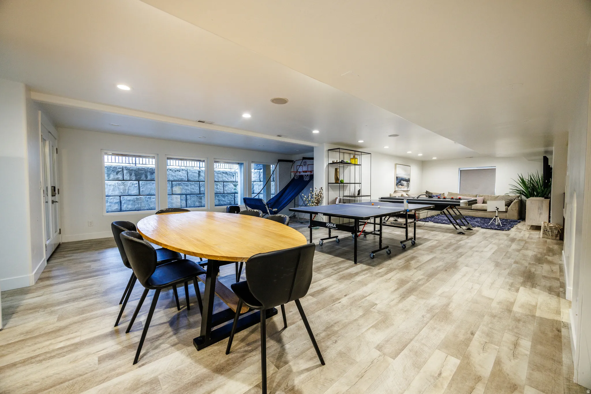 Game room with recessed lighting and light wood-type flooring