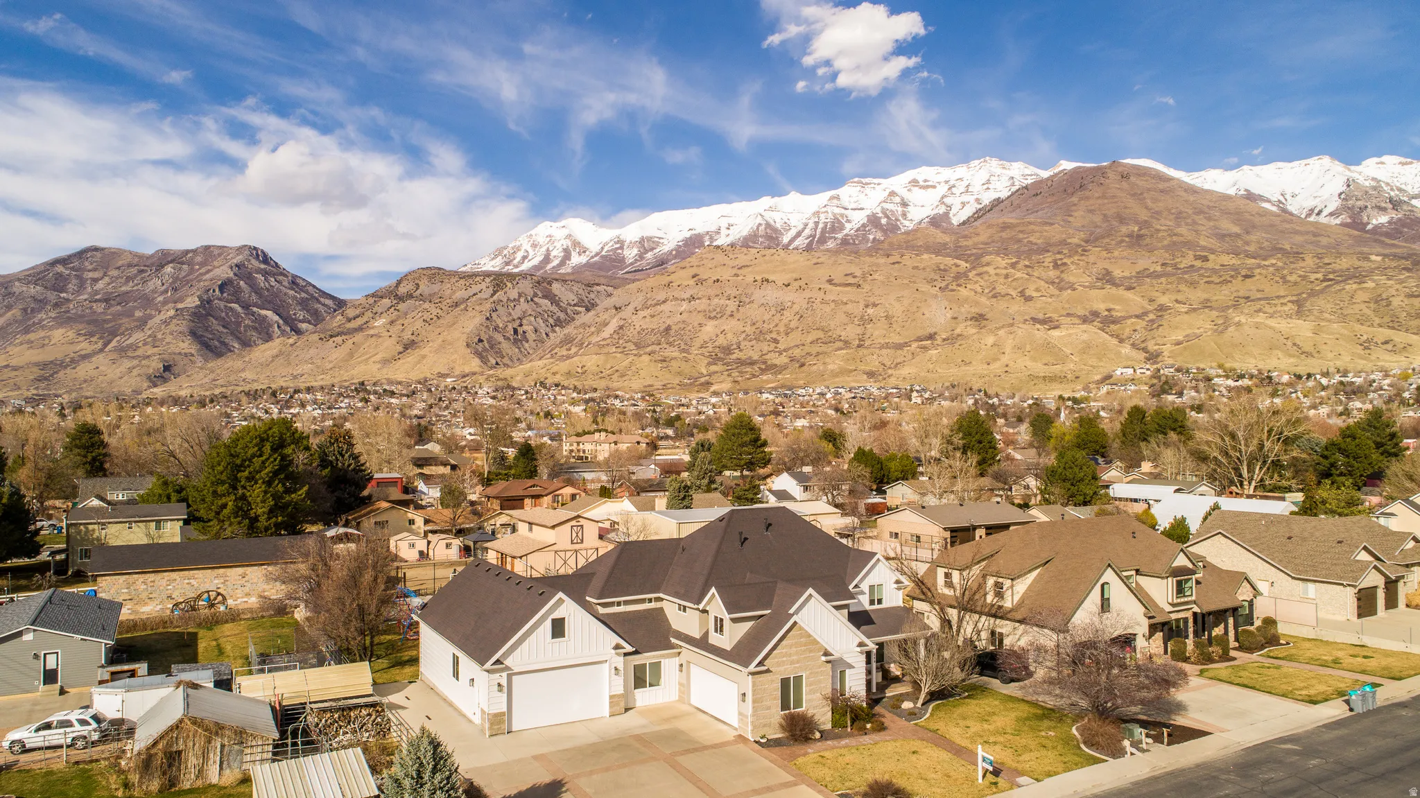 View of mountain backdrop with nearby suburban area