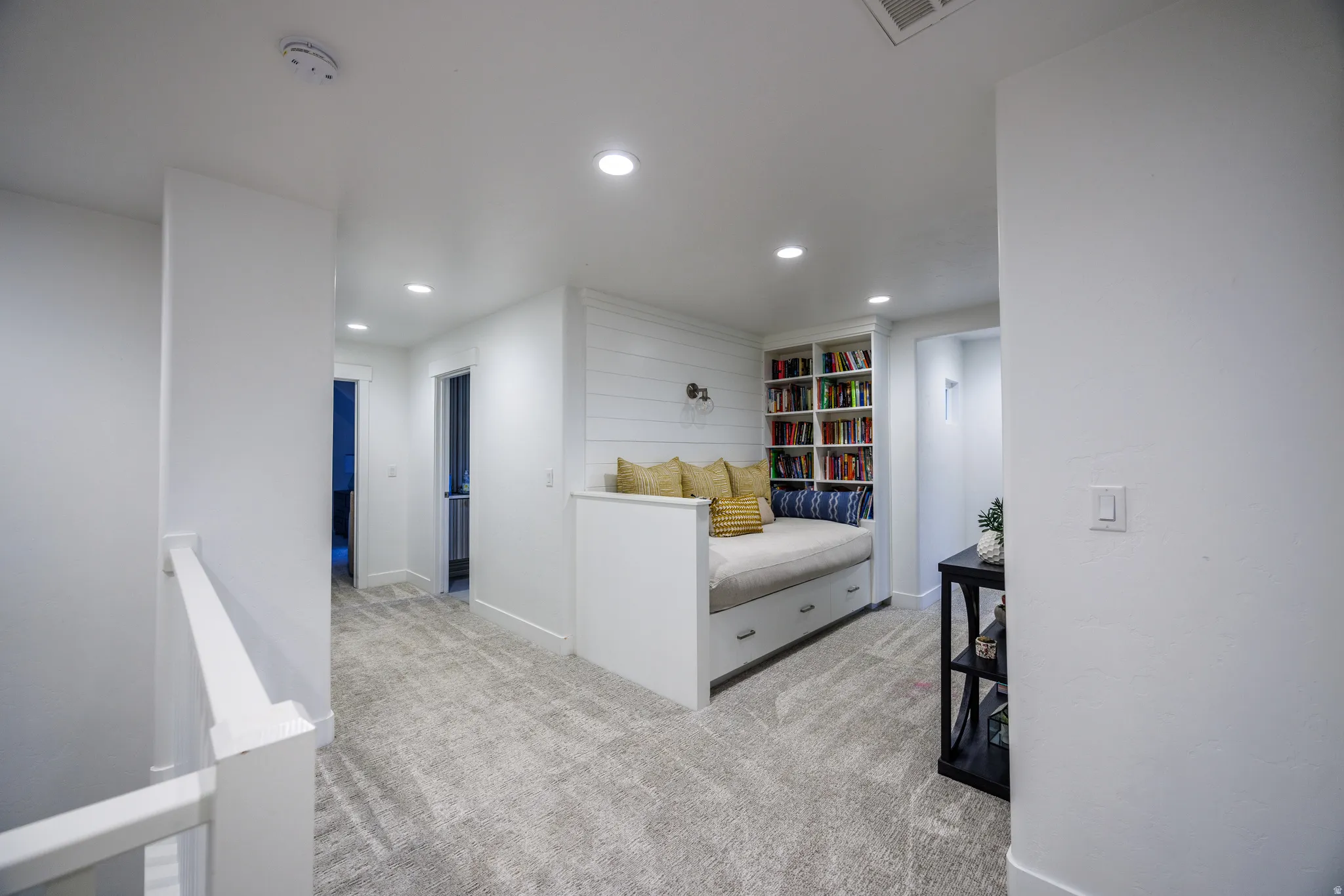 Bedroom with recessed lighting and light colored carpet