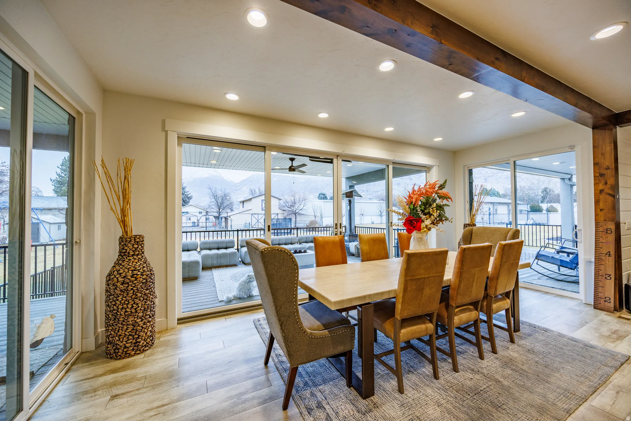 Dining area featuring light wood-style floors, recessed lighting, and beam ceiling