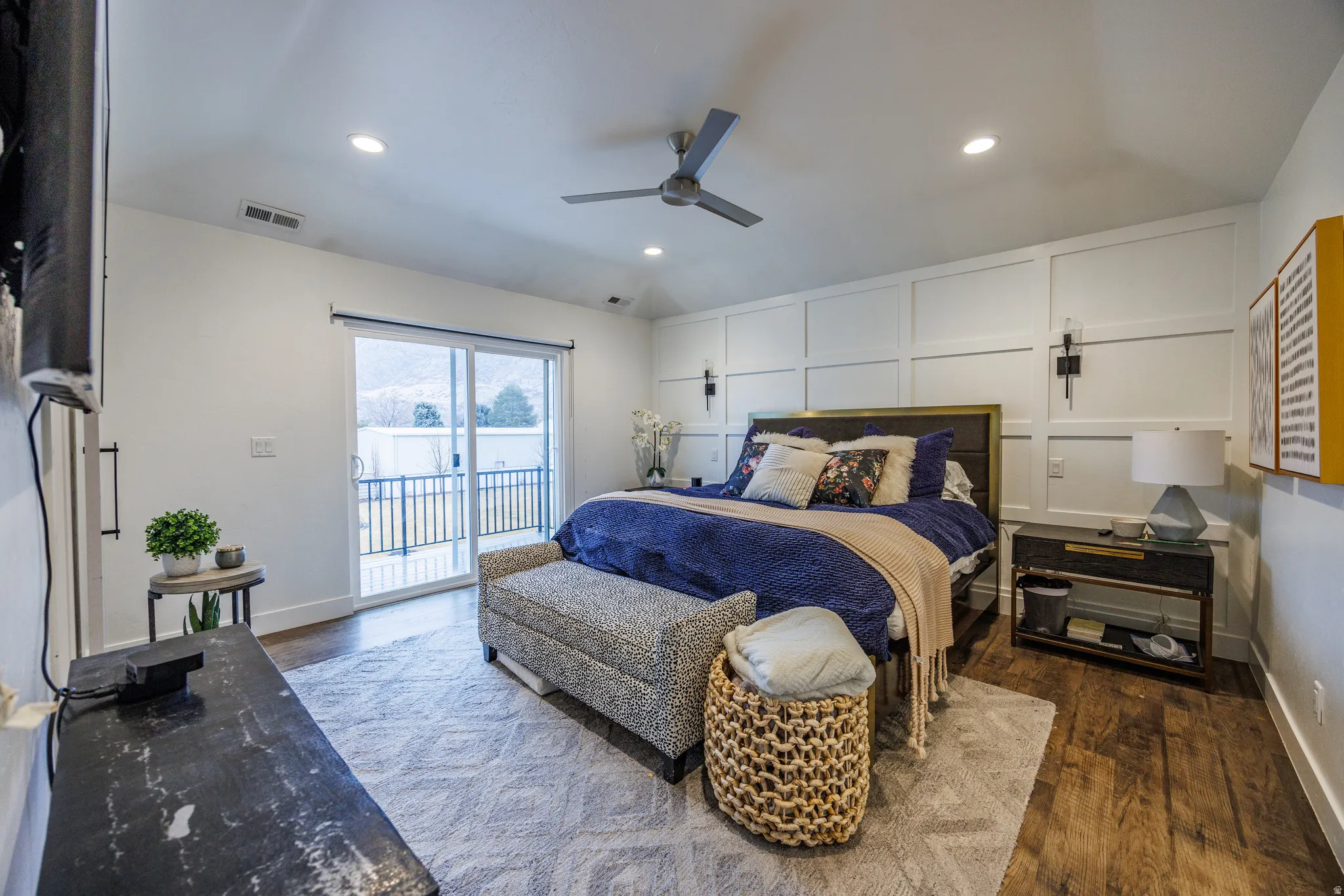 Bedroom featuring vaulted ceiling, dark wood finished floors, a ceiling fan, access to outside, and recessed lighting