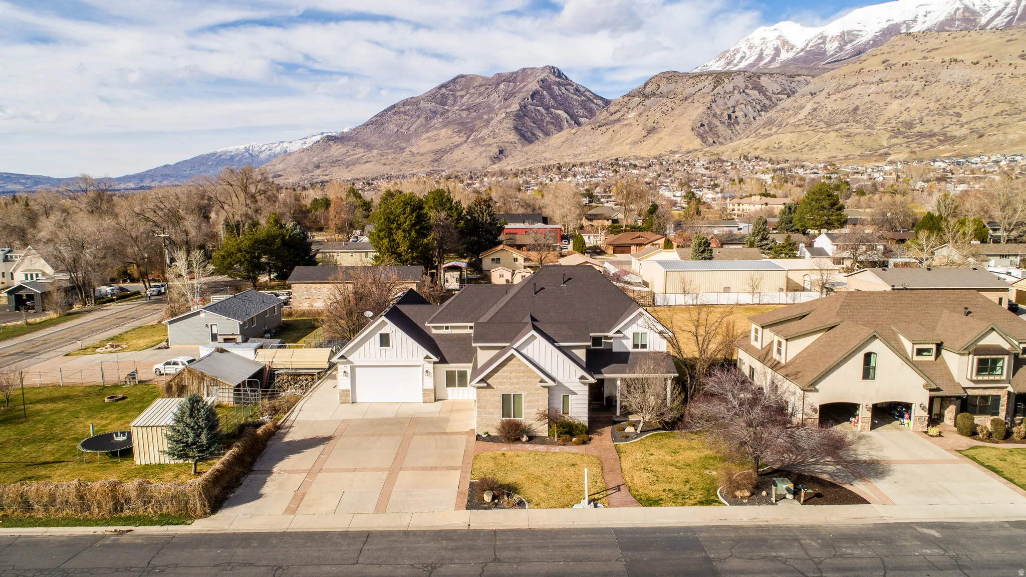 Aerial view of residential area with a mountainous background