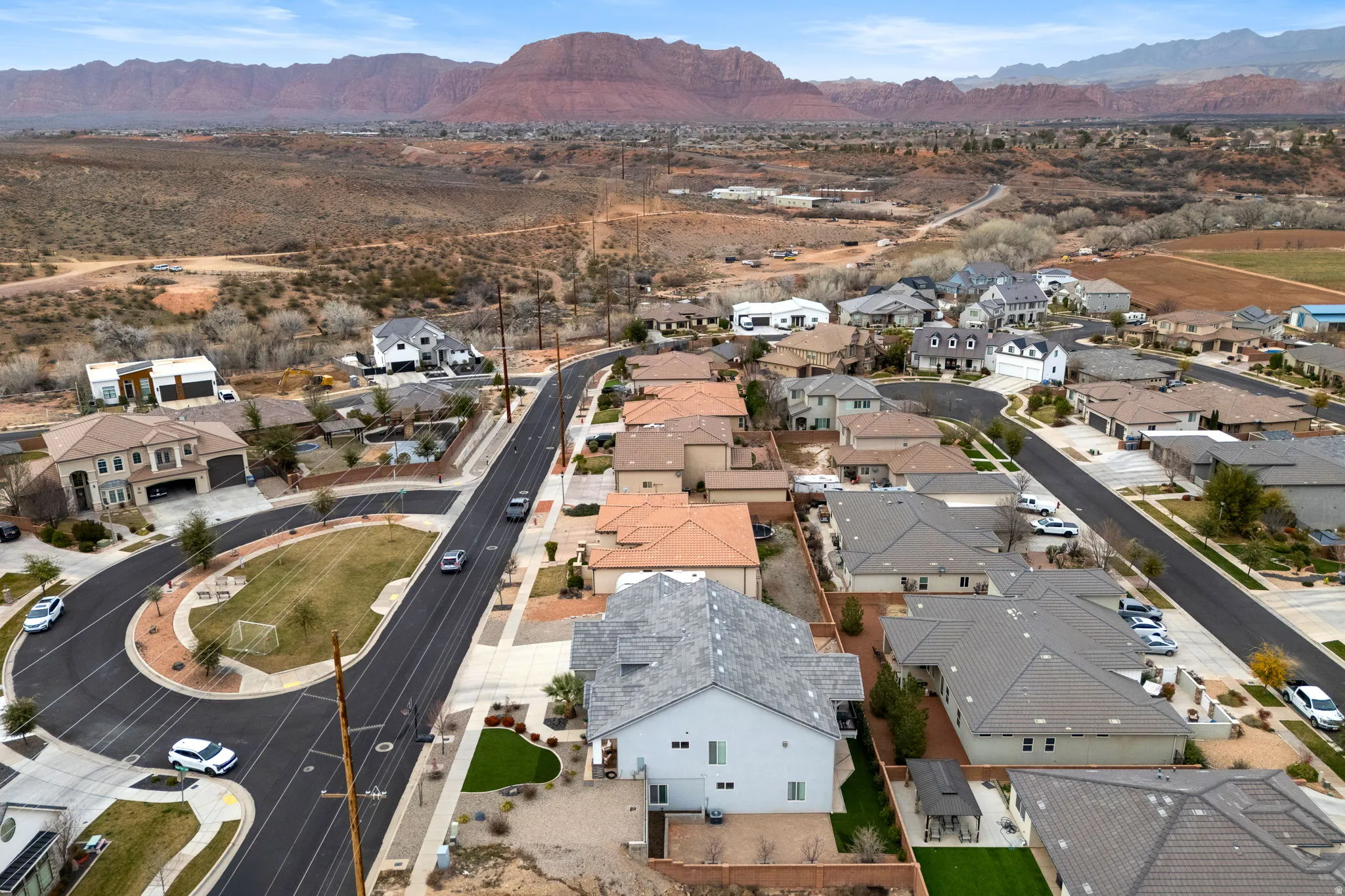 Aerial perspective of suburban area featuring a mountainous background