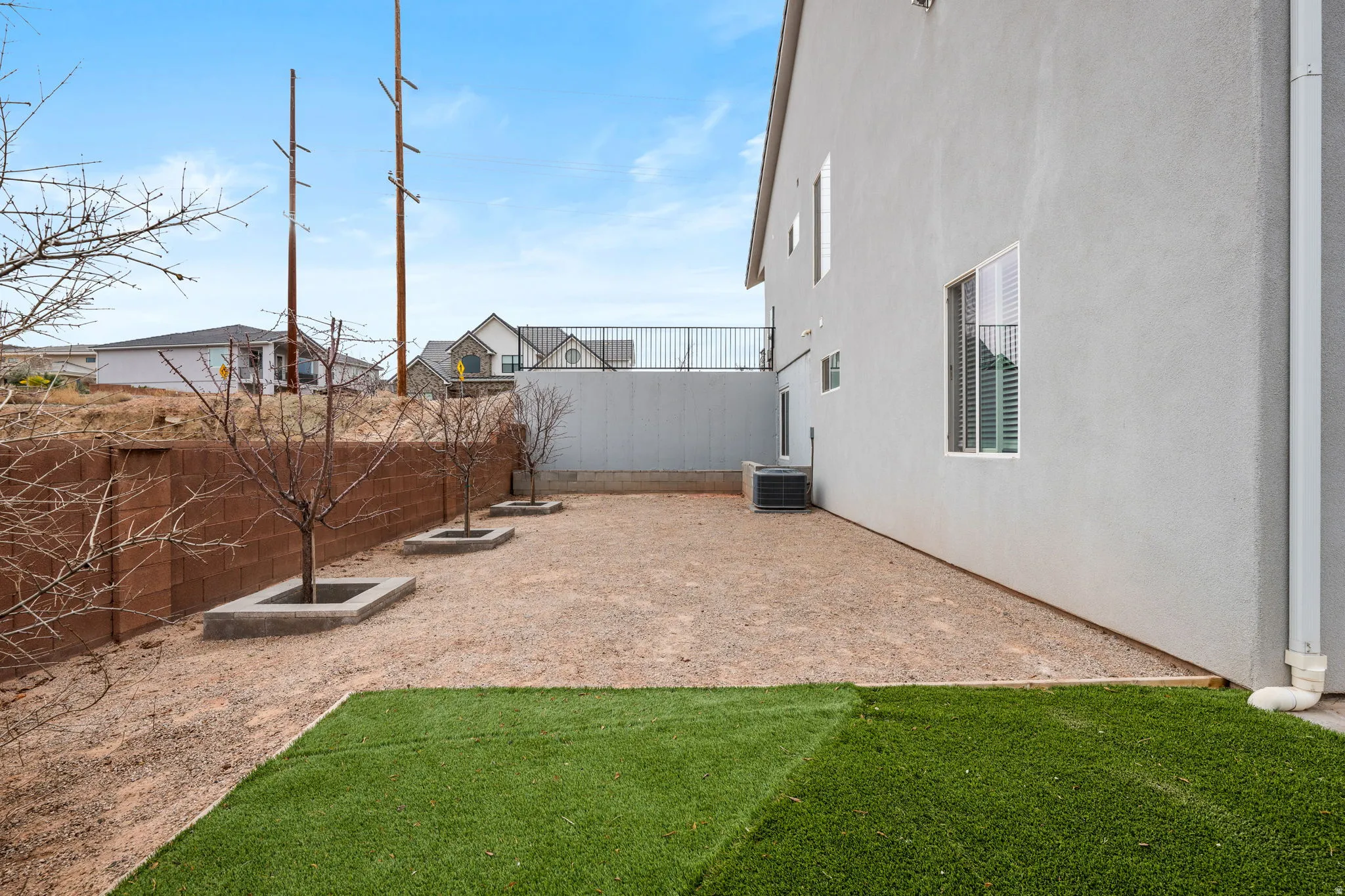 View of fenced backyard