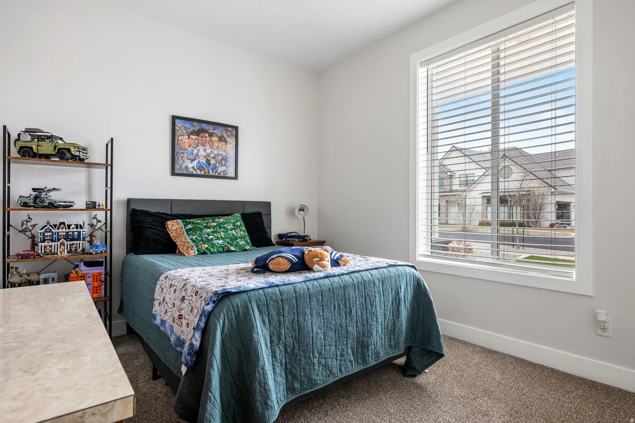 Bedroom featuring carpet flooring and baseboards