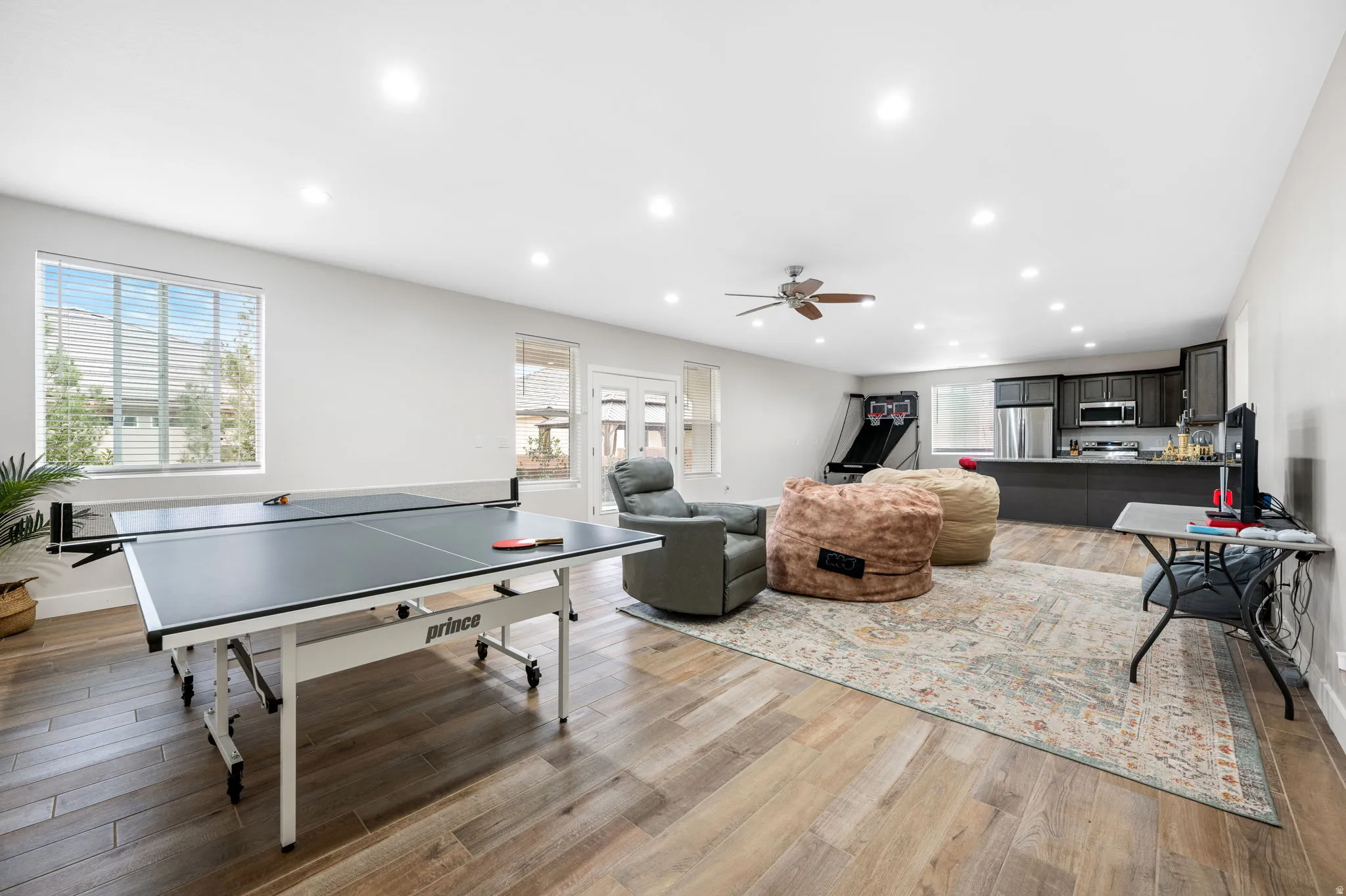 Playroom featuring ceiling fan, light wood-type flooring, and recessed lighting