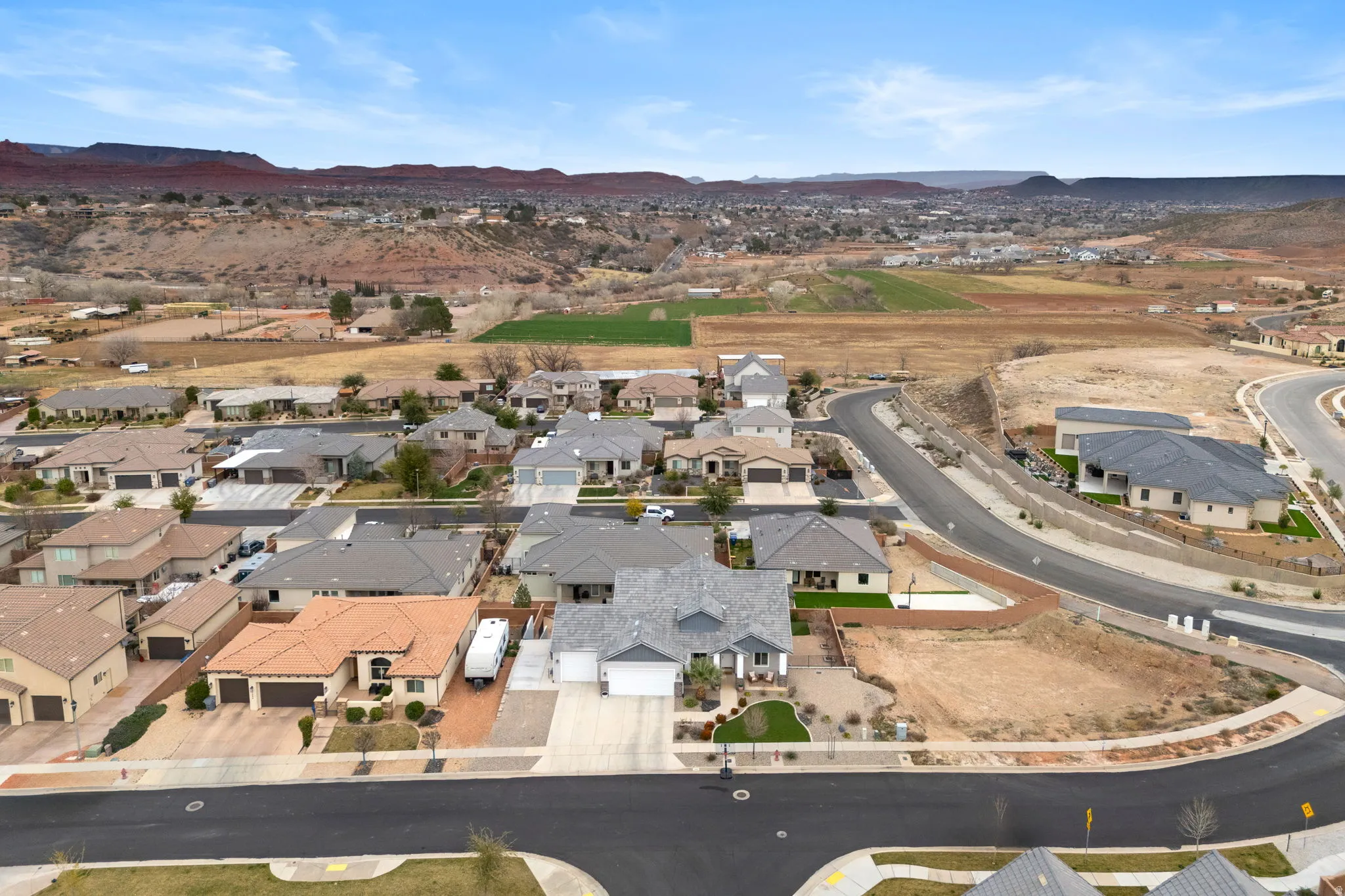 Aerial perspective of suburban area with a mountain backdrop