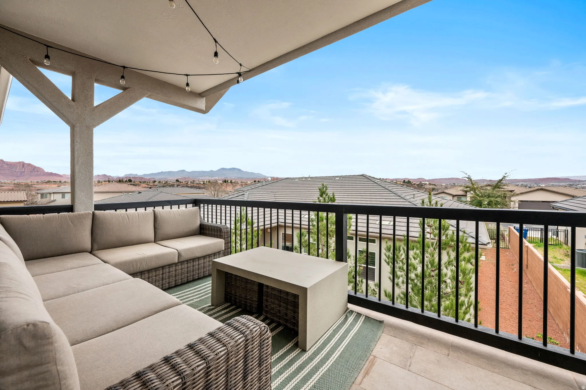 Balcony featuring an outdoor hangout area, a residential view, and a mountain view