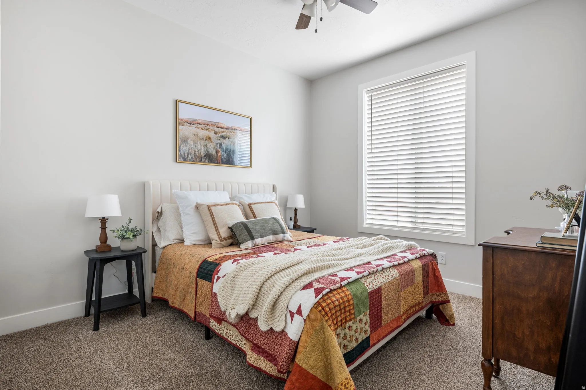 Bedroom with carpet and a ceiling fan