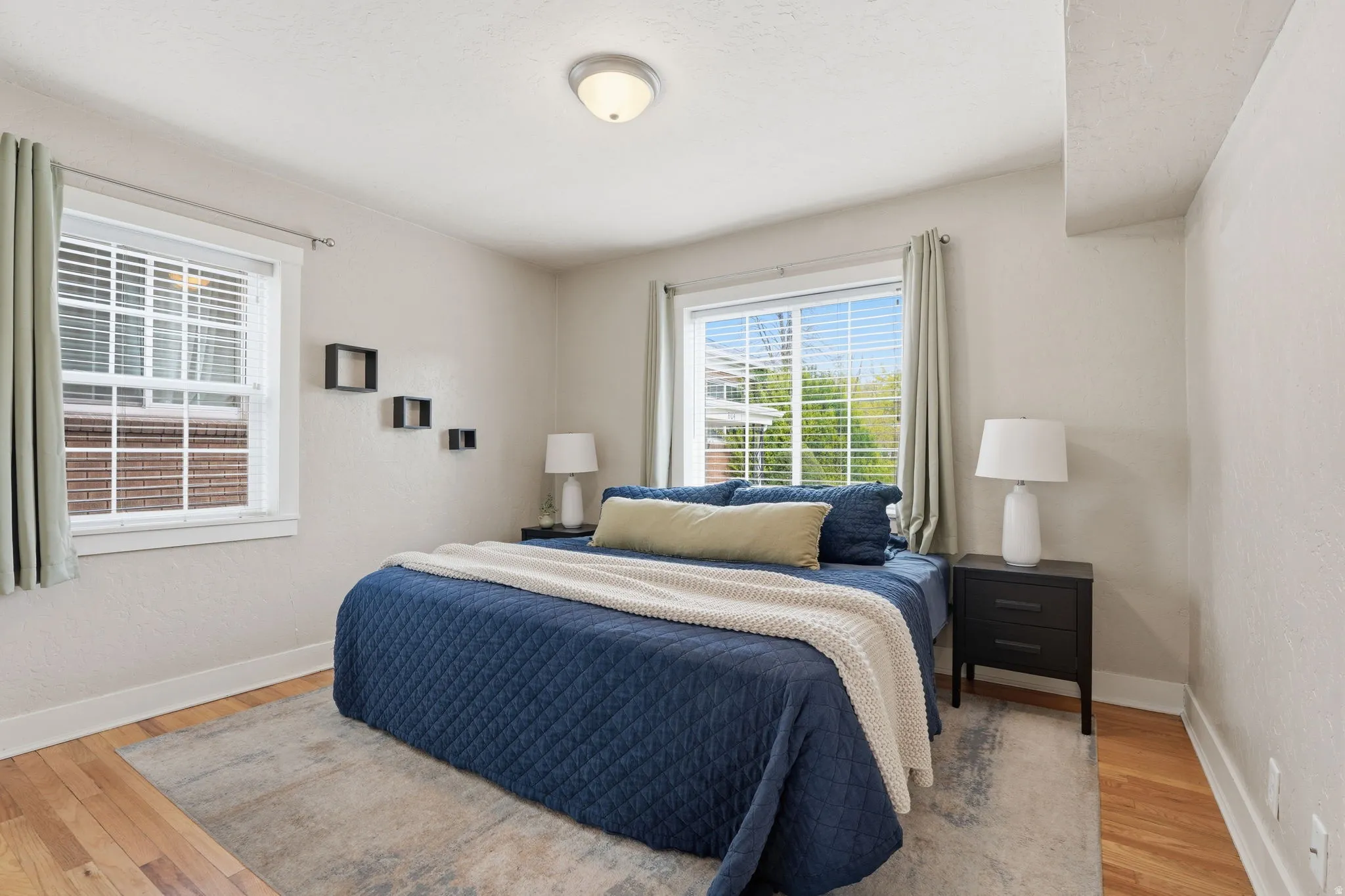 Bedroom featuring baseboards and light wood-type flooring