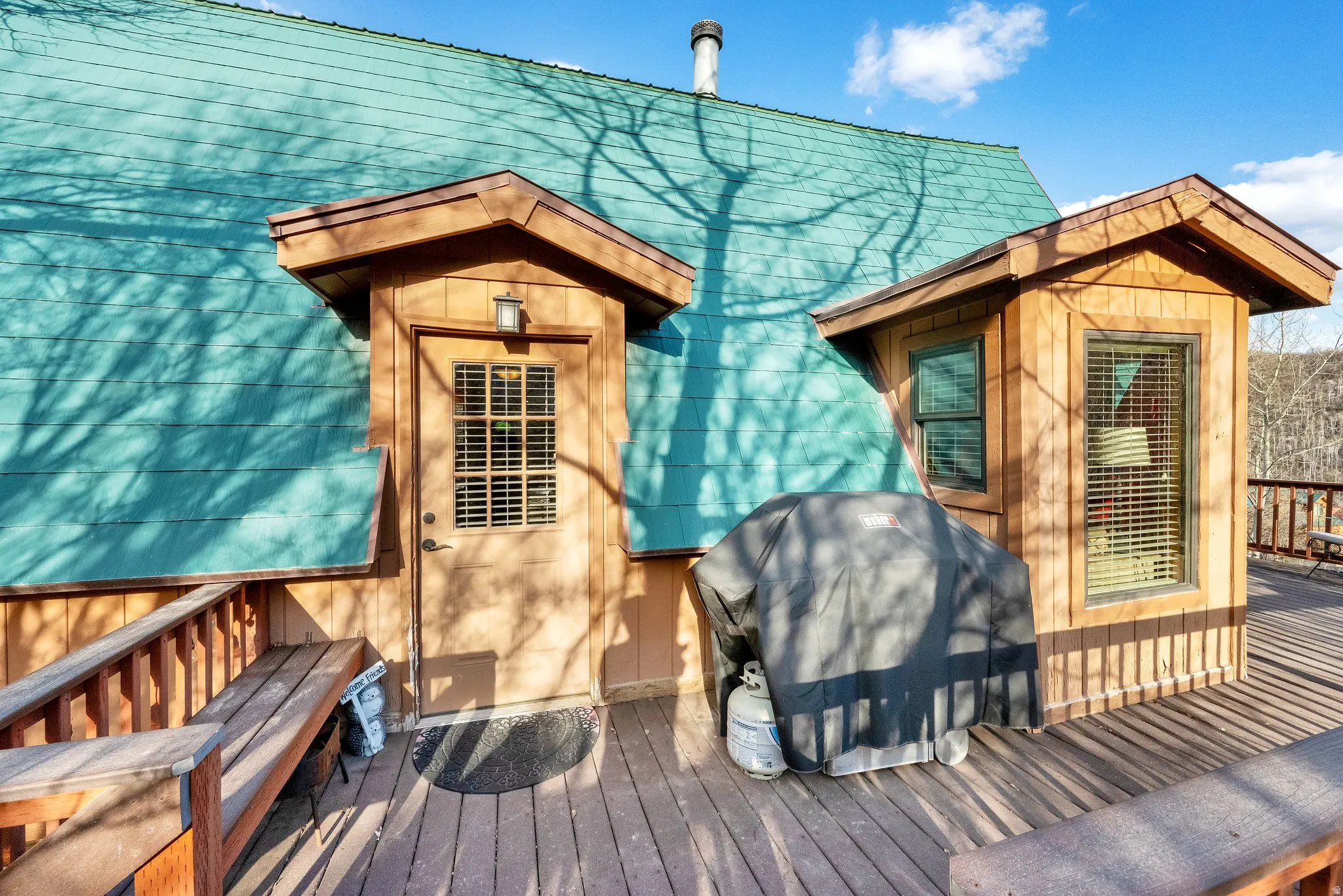 Wooden terrace with area for grilling