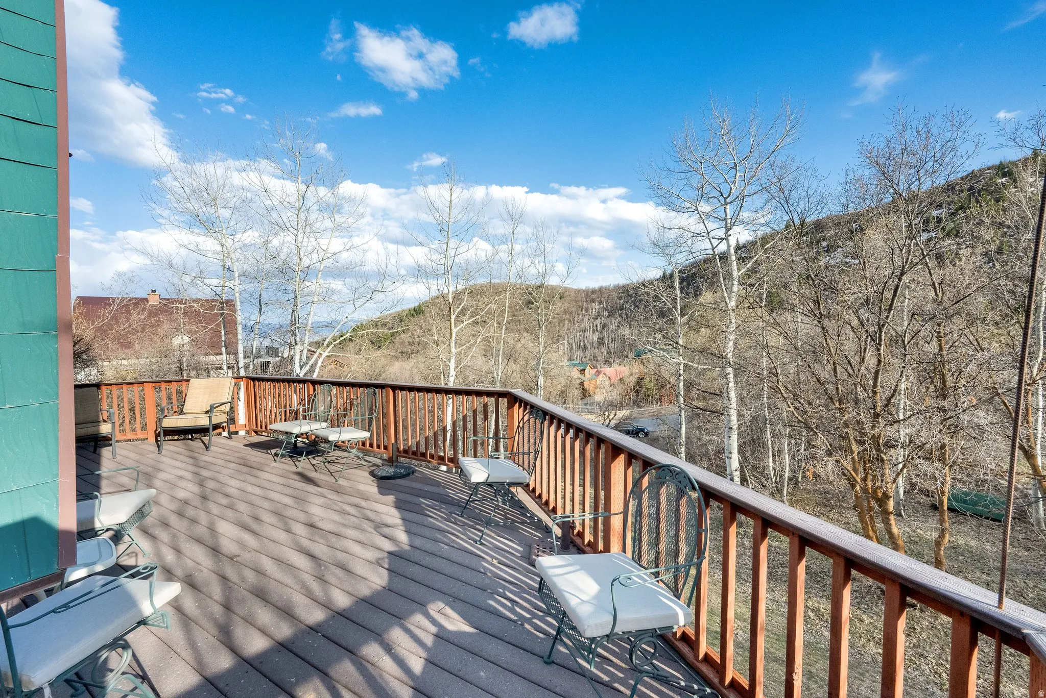 Wooden terrace featuring a mountain view