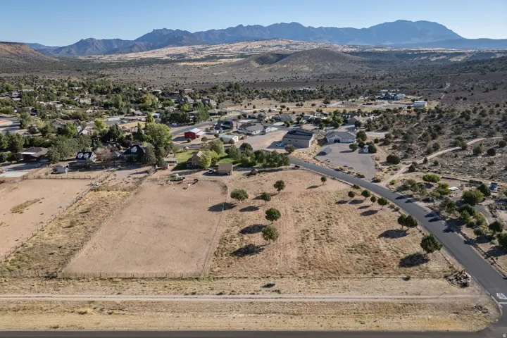 Aerial view of property's location featuring mountains and rural landscape